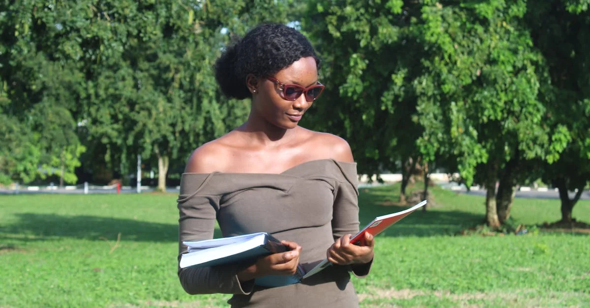 Students preparing for GRE exam with books and laptops