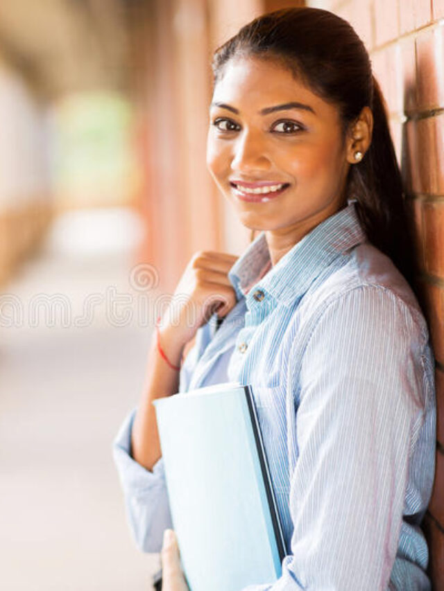 cropped-indian-college-student-happy-leaning-against-wall-41033185.jpg